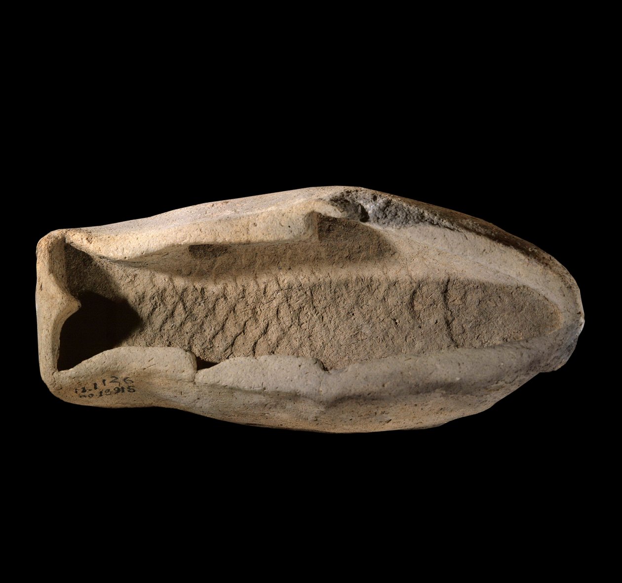 Terracotta Mold in the Shape of Fish by Mesopotamian