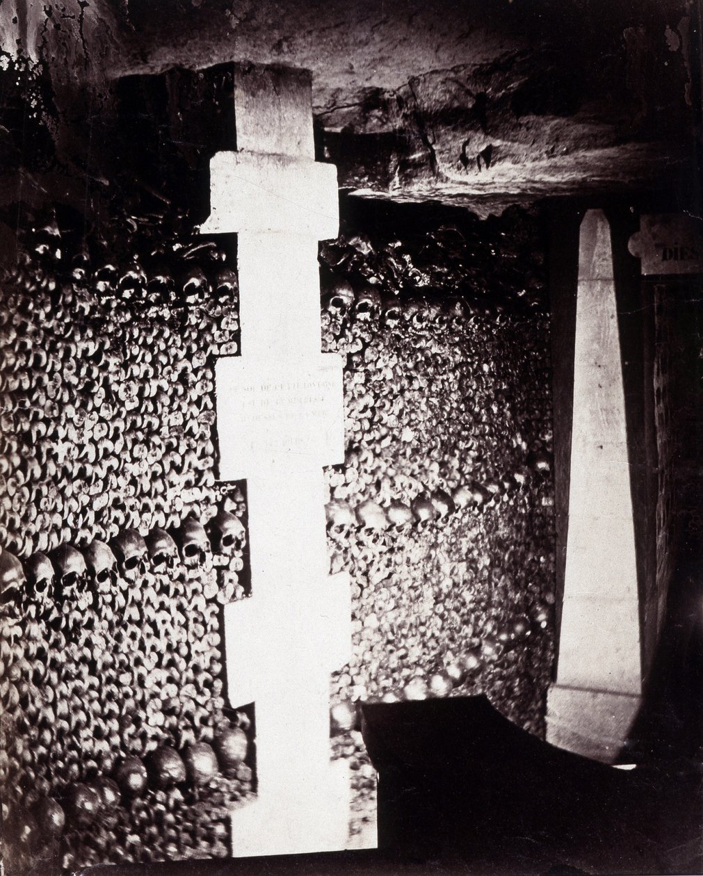 The ossuaries of the catacombs of Paris. Near the source of Lethe or Forget by Nadar