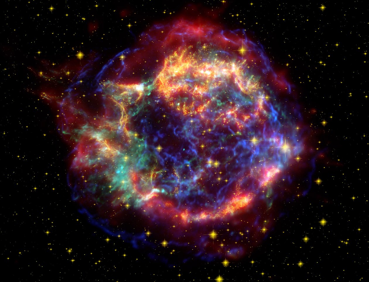 False-colour image of supernova remnant Cassiopeia A by National Aeronautics and Space Administration National Aeronautics and Space Administration