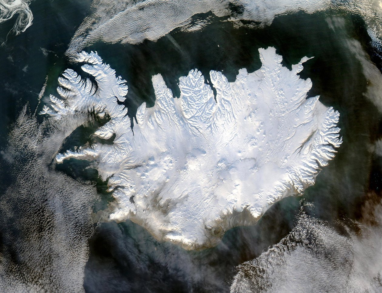 Satellite image of Iceland on 28 January 2004 showing it covered in a blanket of snow and ice which is obscuring the permanent glaciers and icecaps that exist year-round by National Aeronautics and Space Administration National Aeronautics and Space Administration