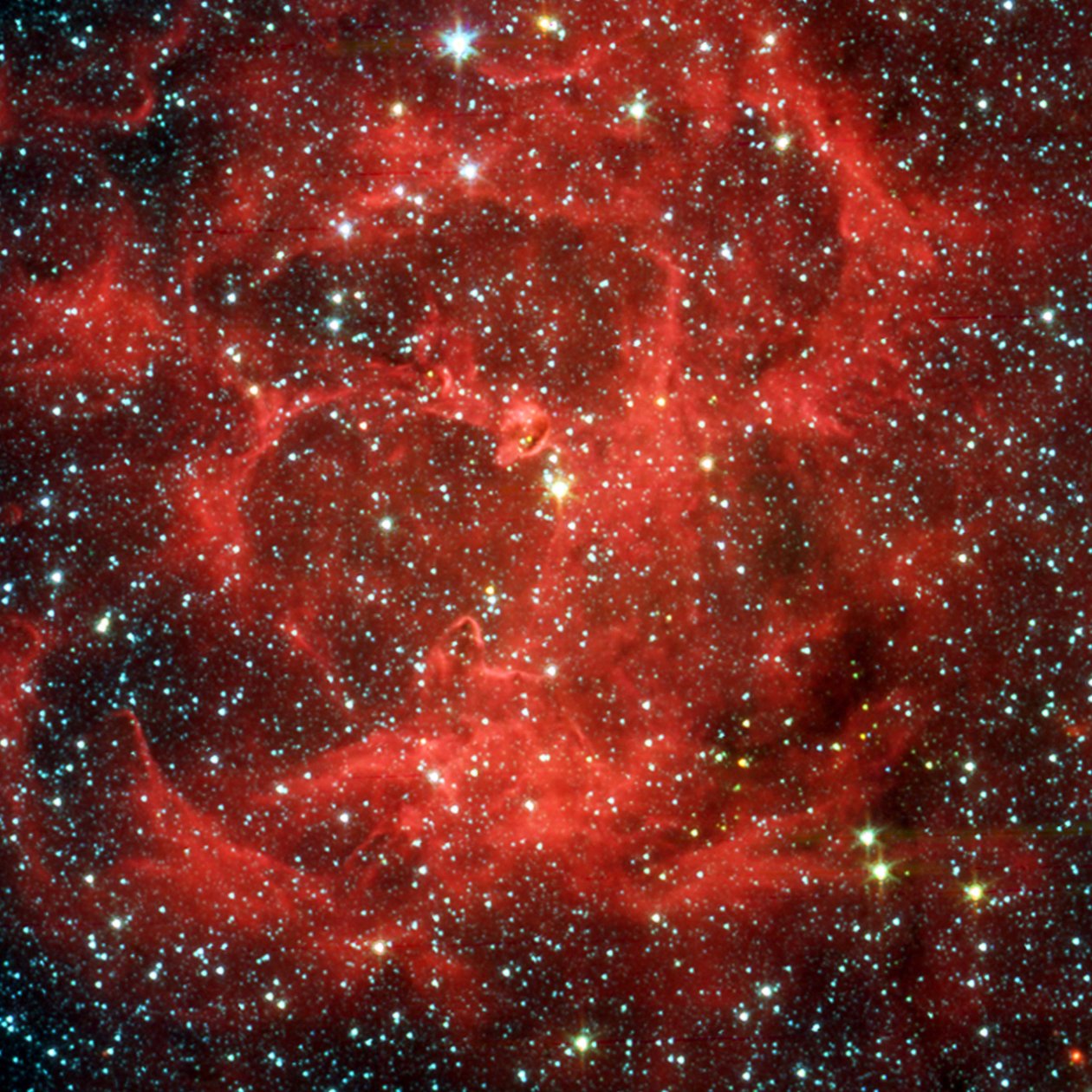 Spitzer Space Telescope comparison views in visible light and infrared of the Trifid Nebula by National Aeronautics and Space Administration National Aeronautics and Space Administration