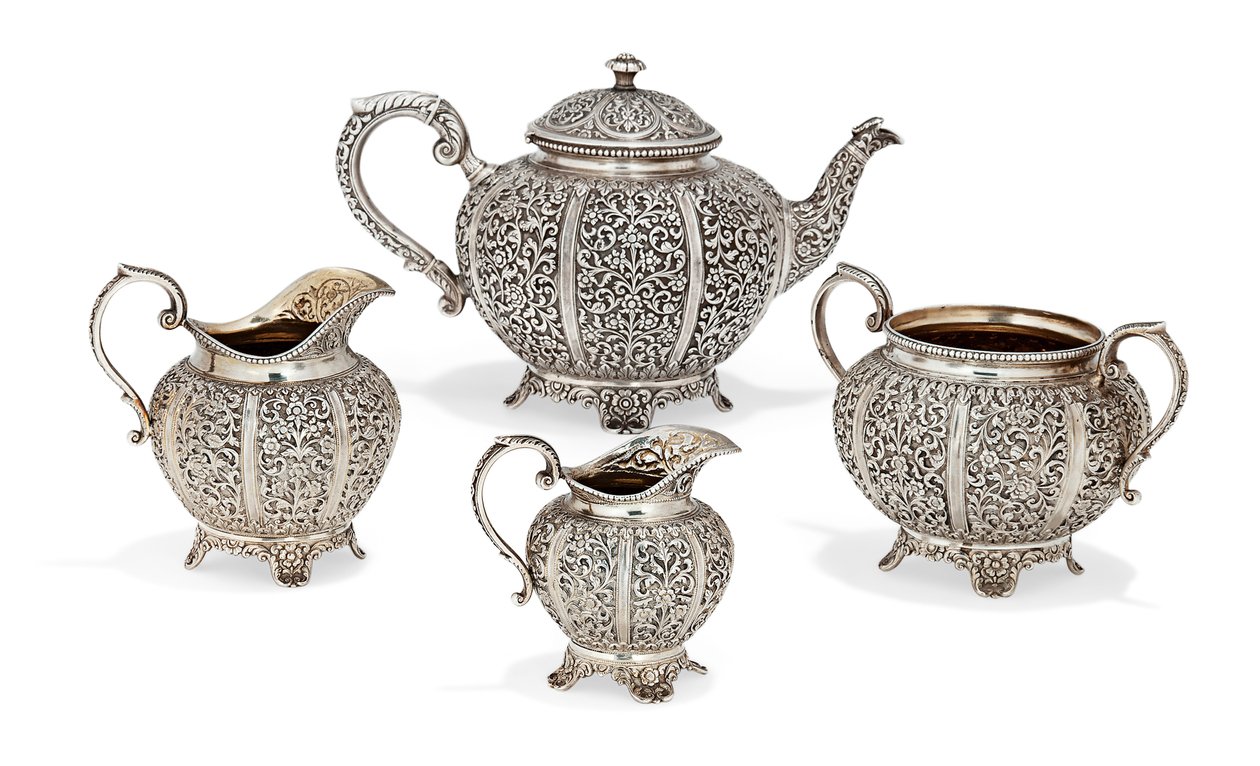 Repousse four-piece tea set, late 19th century by Oomersi Mawji