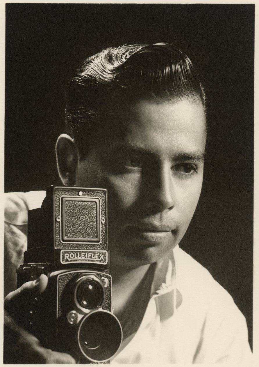 Orlando Suero portrait with Rolleiflex camera by Orlando Suero
