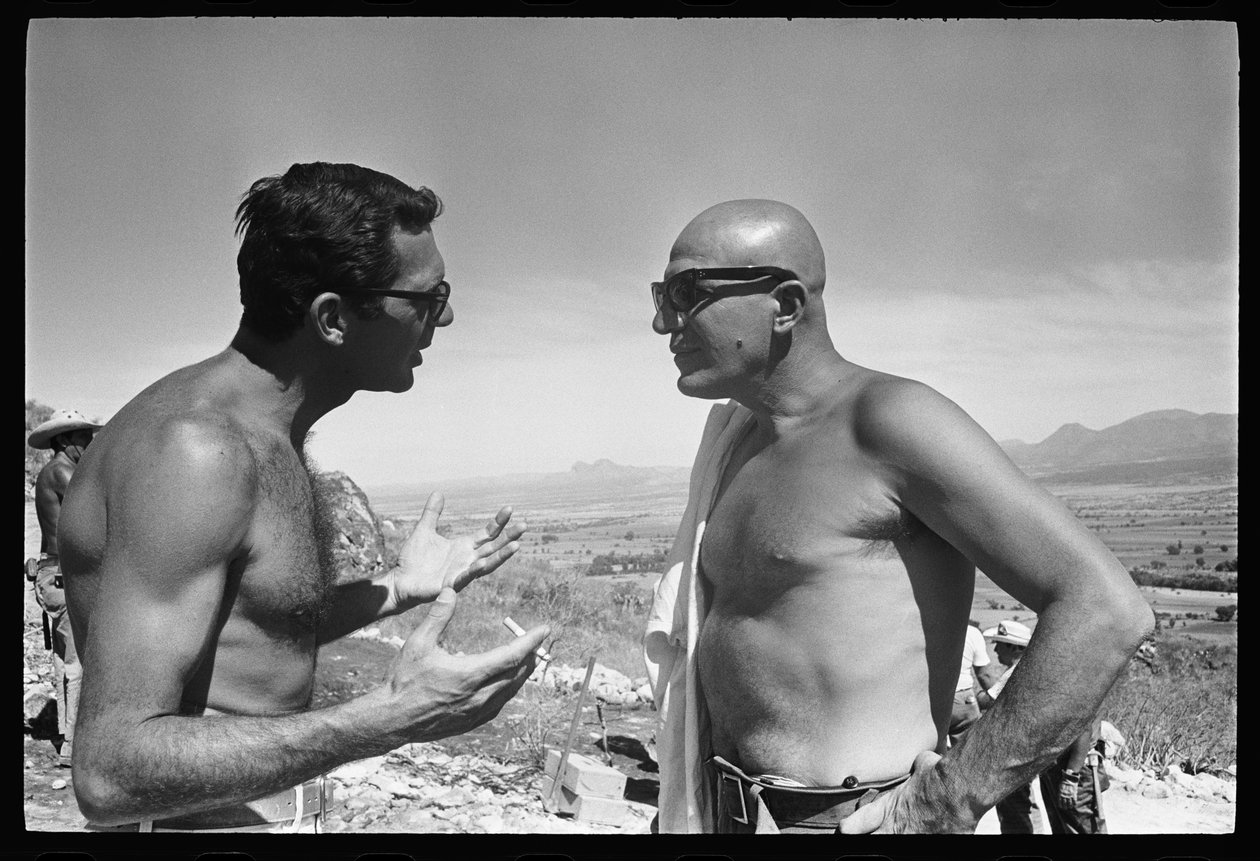 Sydney Pollack and Telly Savalas on set of 