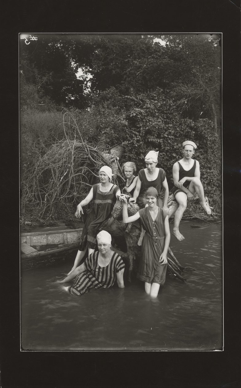 Group of One Man and Four Women in Swimming Suits Seated on a River Bank by Oscar C. Kuehn