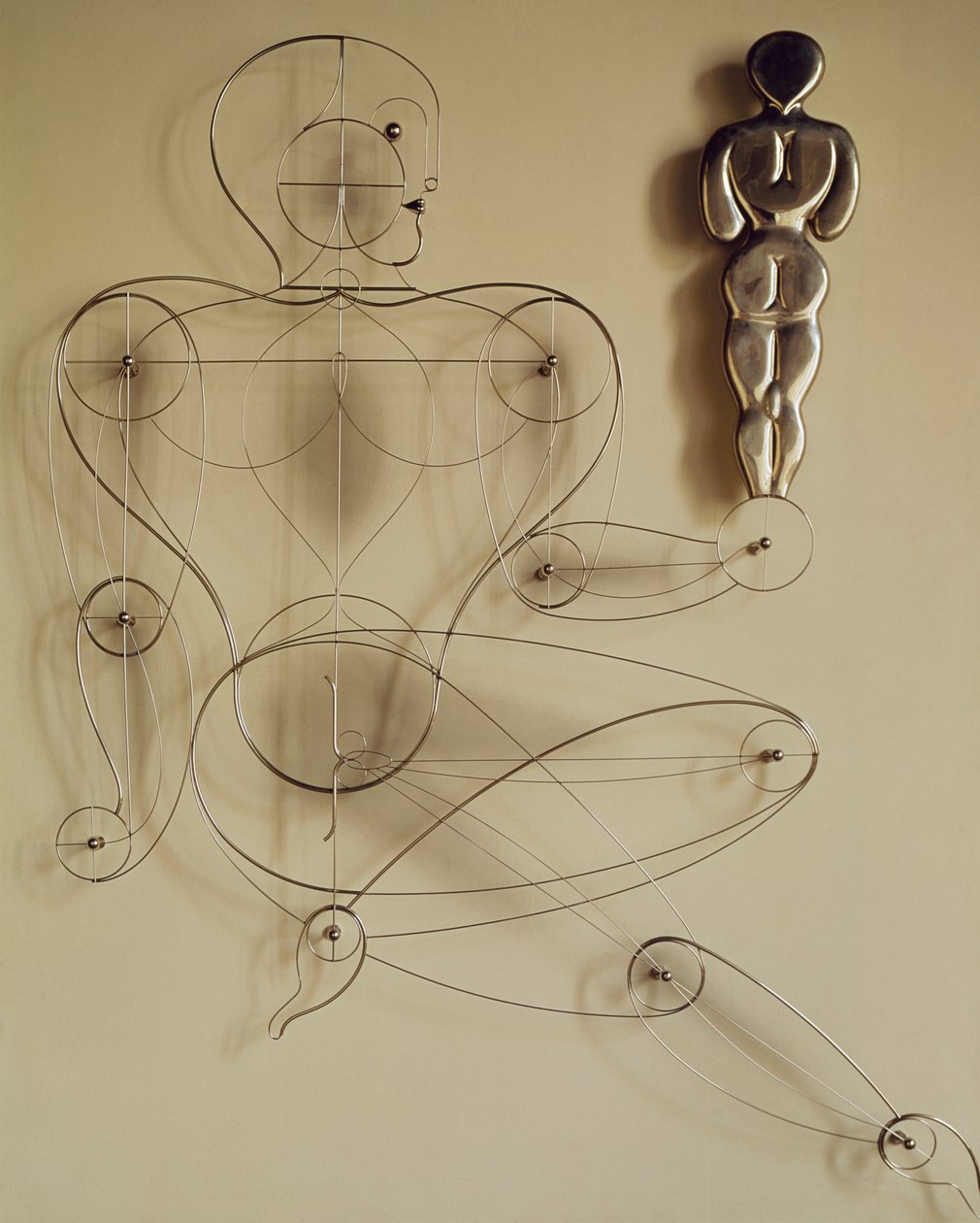 Homo, wire figure with rear view figure in its hand by Oskar Schlemmer