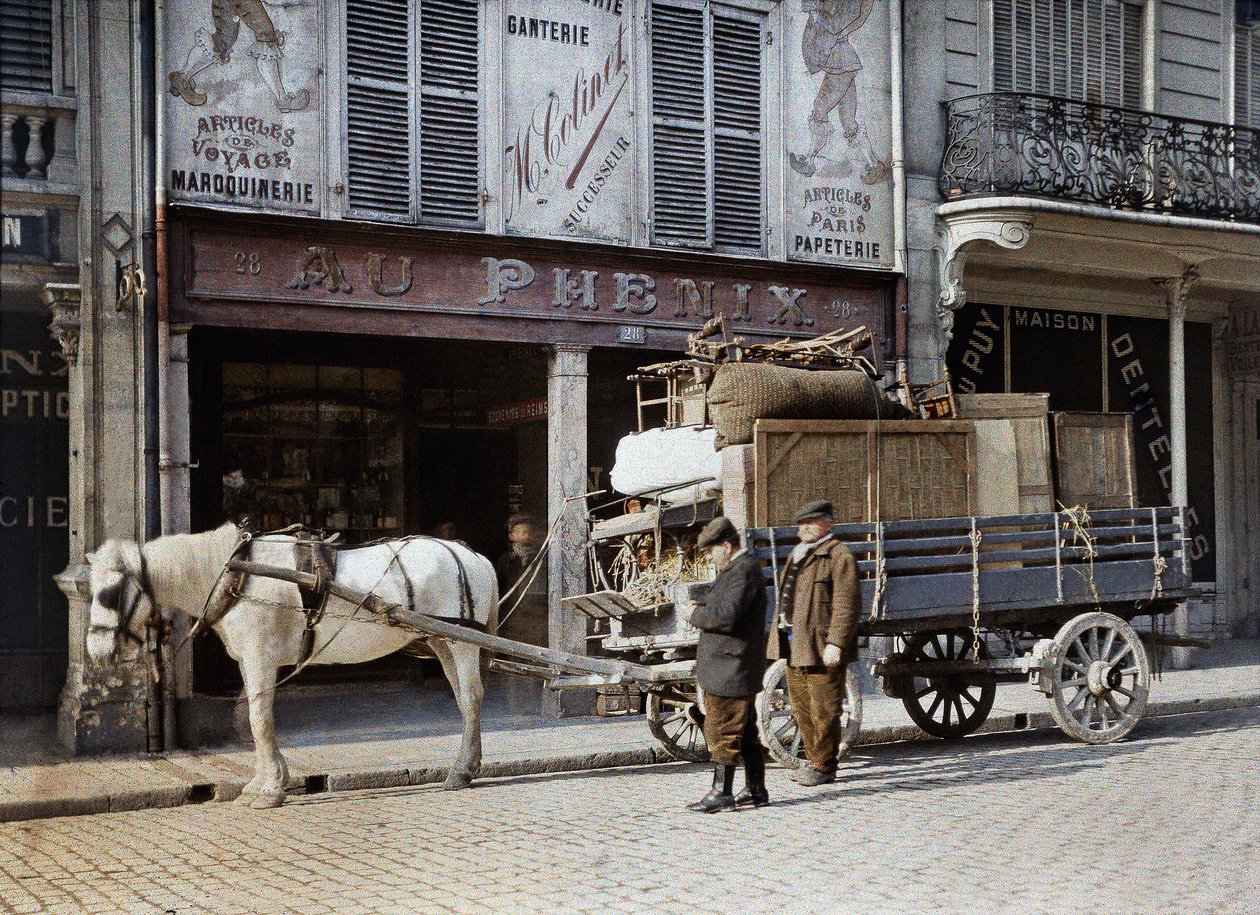 A horse cart loaded with furniture and personal belongings in front of a leather goods shop, Reims, France, May 4, 1917 by Paul Castelnau