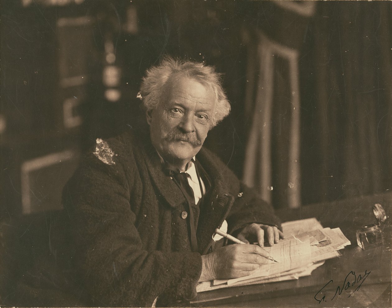 Félix Nadar Seated at Writing Table by Paul Nadar