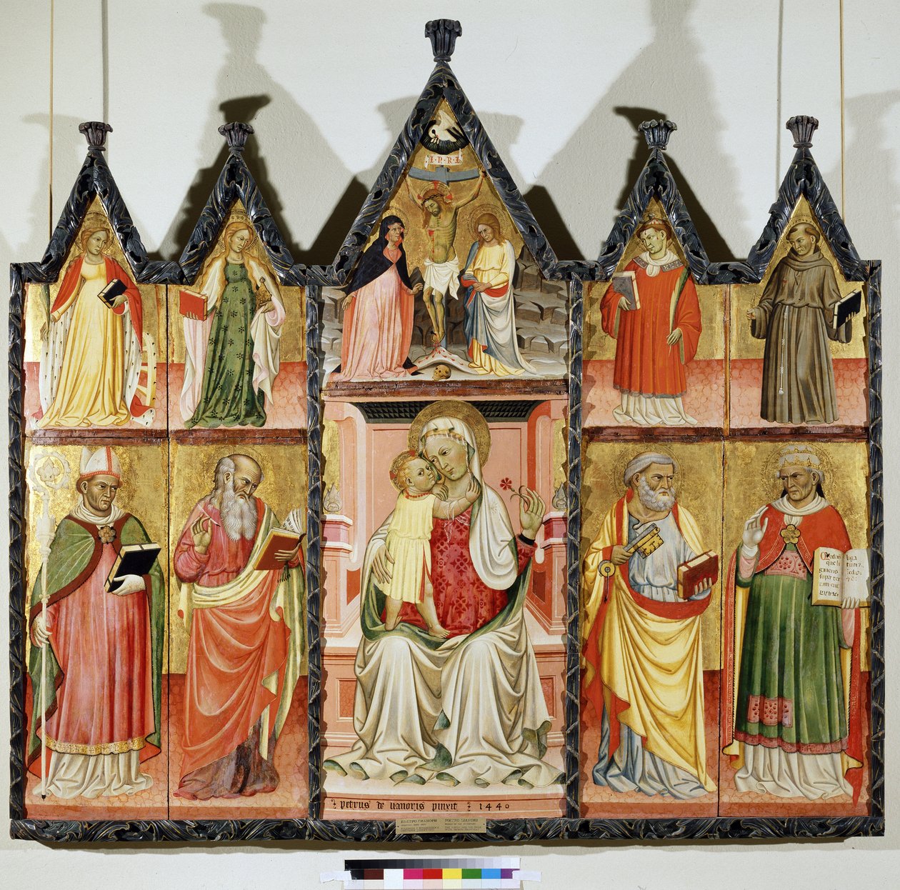 Polyptych of the Virgin and Child with Saints. Top left: Saint Catherine of Alexandria and Saint Mary Magdalene. Center around Christ on the Cross with the inscription "INRI". The Virgin Mary and Saint John. Top right: Saint by Pietro di Giovanni Lianori