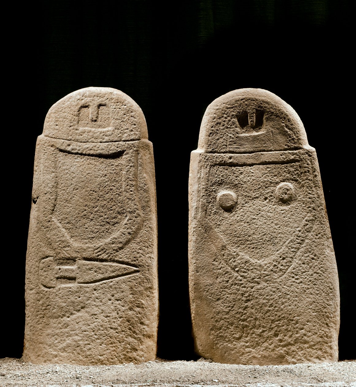 Two menhirs of man and woman dating from the Iron Age from the site of Lunigiana near La Spezia, Italy. 1100-800 BC. La Spezia, Museo Comunale della Civilta Lunigiana by Prehistoric Prehistoric