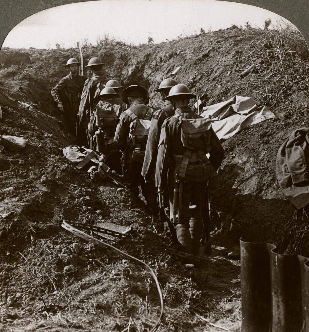 Officer watching his men file into a dug-out to avoid a German strafe, World War I by Realistic Travels Publishers