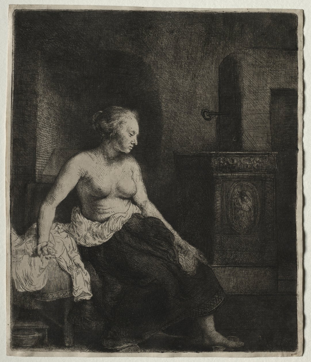 Woman Sitting Half Dressed Beside a Stove by Rembrandt van Rijn
