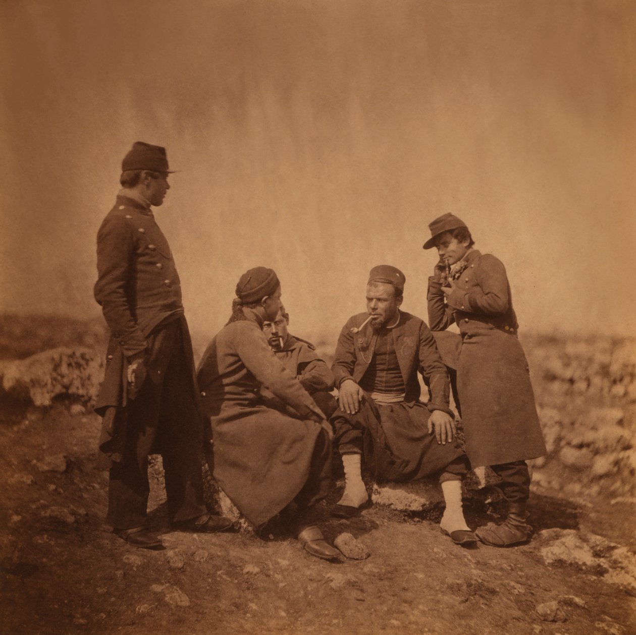 Two French Soldiers Standing next to Three Zouave Soldiers Sitting and Smoking, Crimean War, Crimea, Ukraine by Roger Fenton