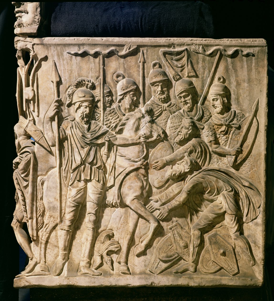 Relief from a sarcophagus depicting the submission of a barbarian to a Roman troop by Roman