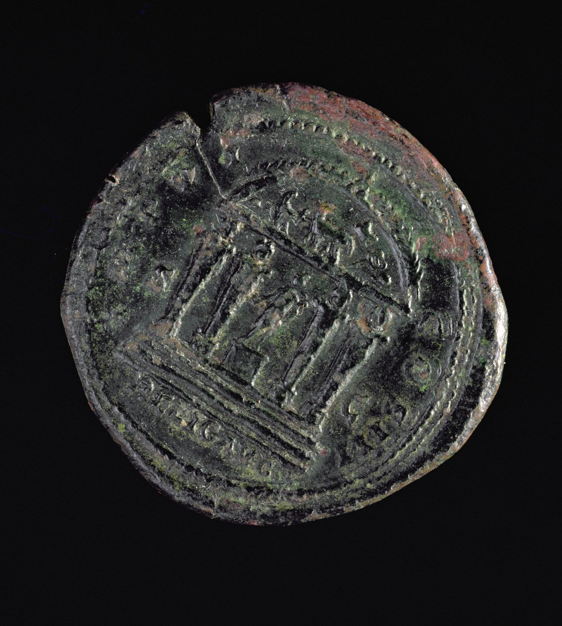 Sestertius (reverse) minted by Marcus Aurelius depicting temple with four columns with heads on top by Roman