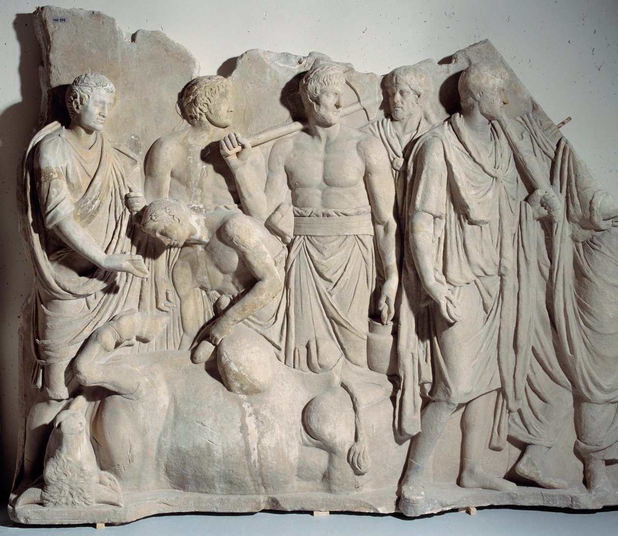 Marble relief from Forum Trajan: scene of haruspice consulting the bowels of a bull with priest and lictors by Roman