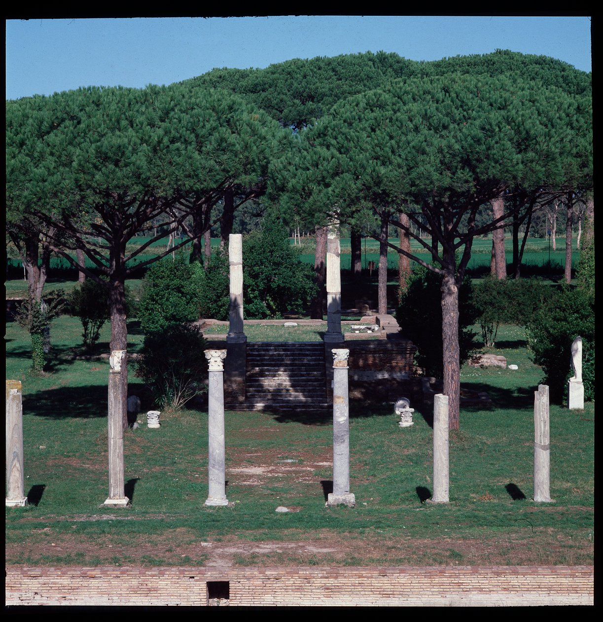 Roman art: view of the ruins of the Temple of Ceres, archeological site of Ostia by Roman