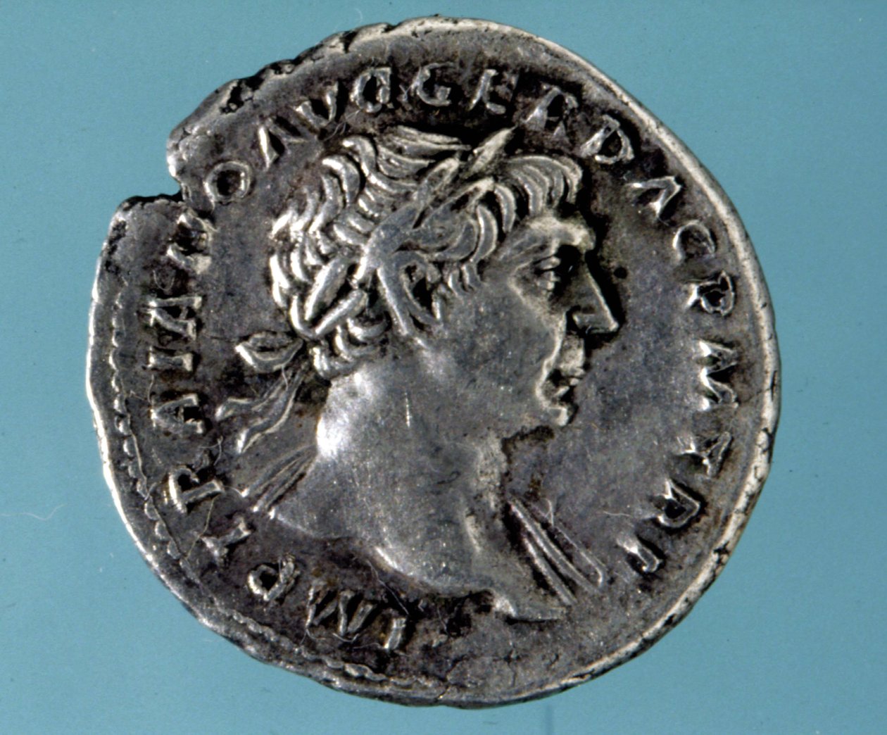 Silver coin with the effigy of the Romanesque emperor Trajan. Collection of the medagliere of Milan by Roman
