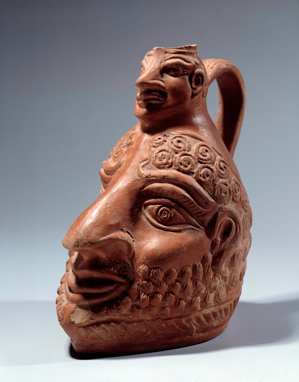 Roman art: terracotta vase in the shape of double head by Roman Roman