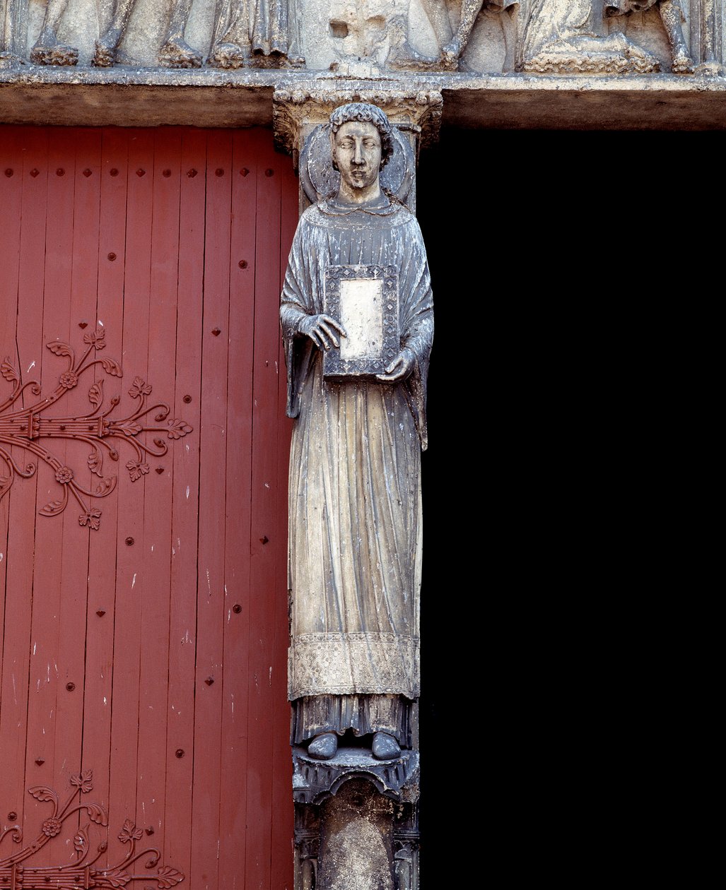 View of a sculpture on the central pillar of the central portal (1140-1200) by Romanesque