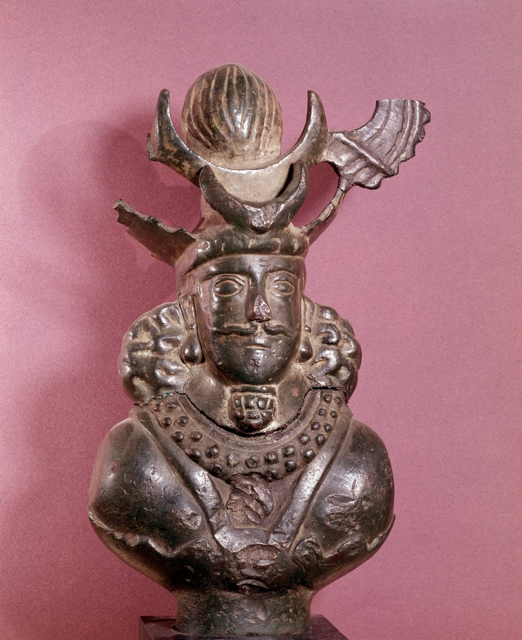 Bust of a Sassanid king in bronze, he wears the royal outfit, with hairstyle featuring a globe supported by lunar crescents. 6th-7th century. E. Borowski Collection by Sasanian School