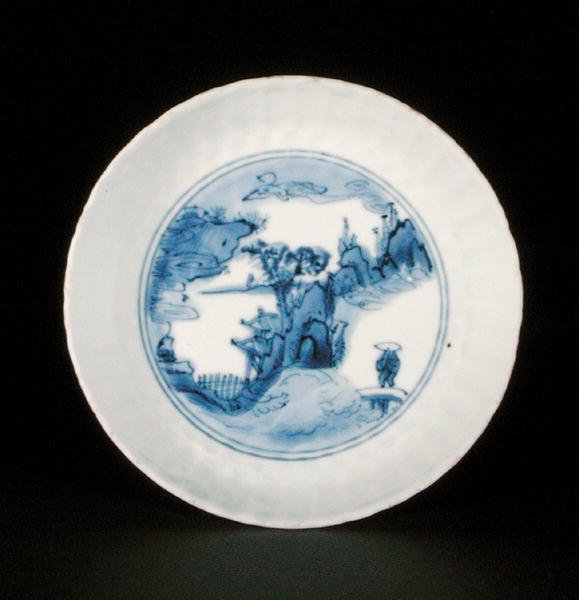 Blue and white kraak saucer dish painted with a figure in a landscape, Egret mark, Wanli or Tianqi by School Chinese