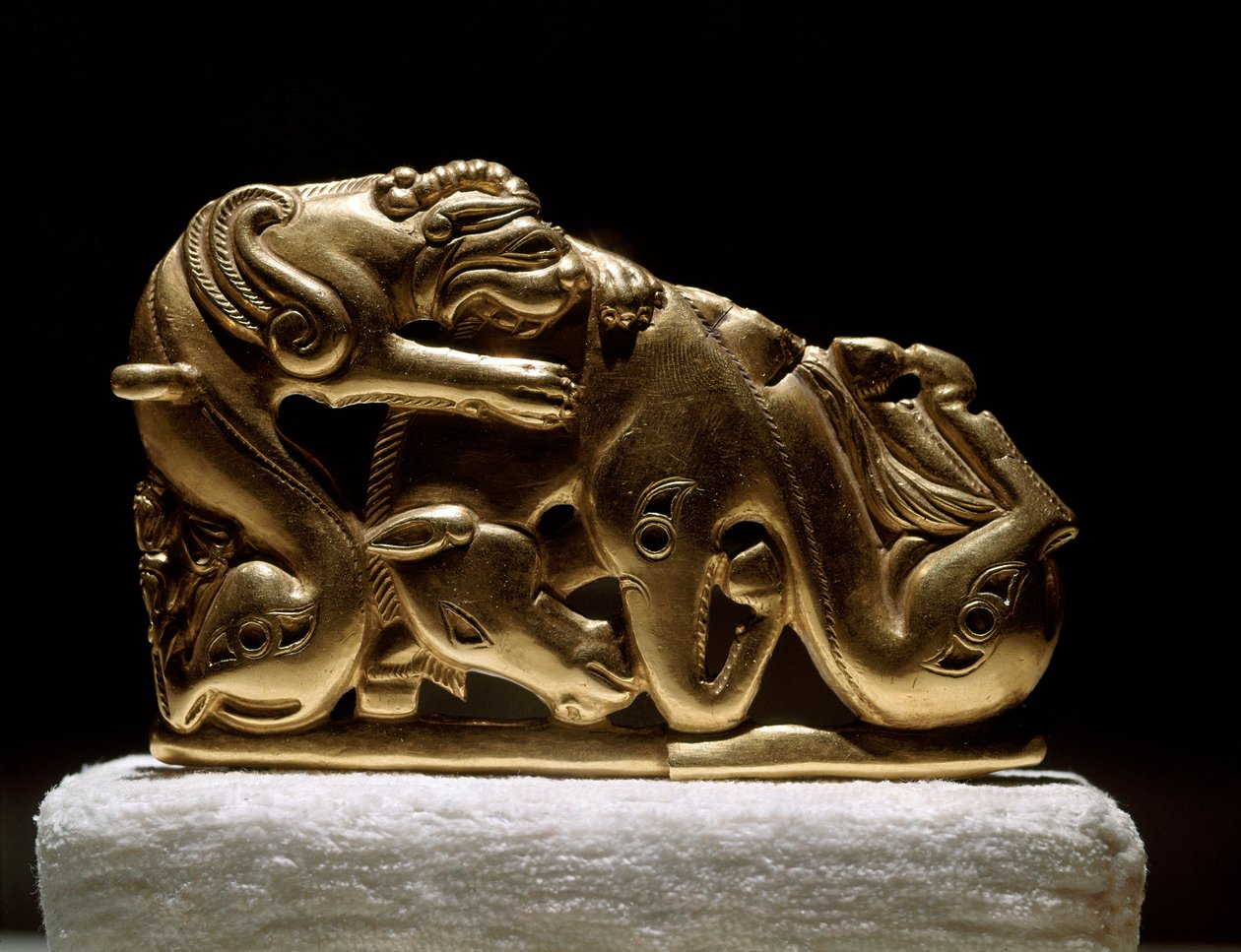 Scythian art: gold belt fibula depicting a griffin attacking a horse. From Chiliktin. 5th-4th century BC by Scythian