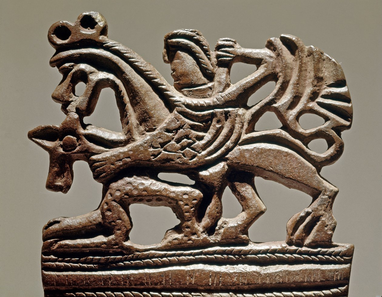 Scythian art: Apollo on a griffin - 4th century BC - Bronze tank ornament