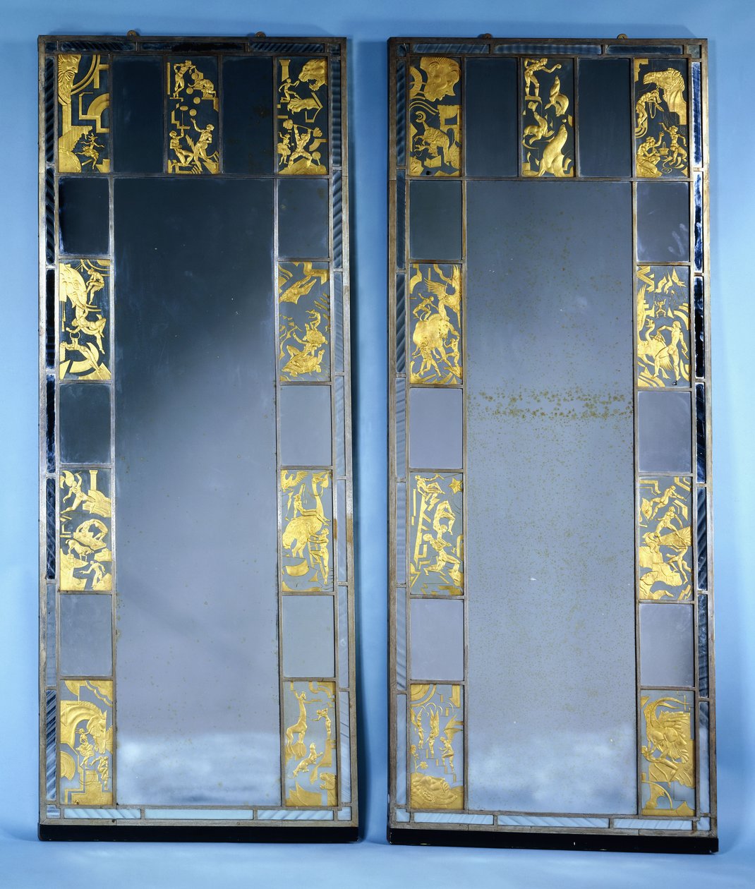 A pair of Orrefors mirrored doors, with circus scenes by Simon Gate