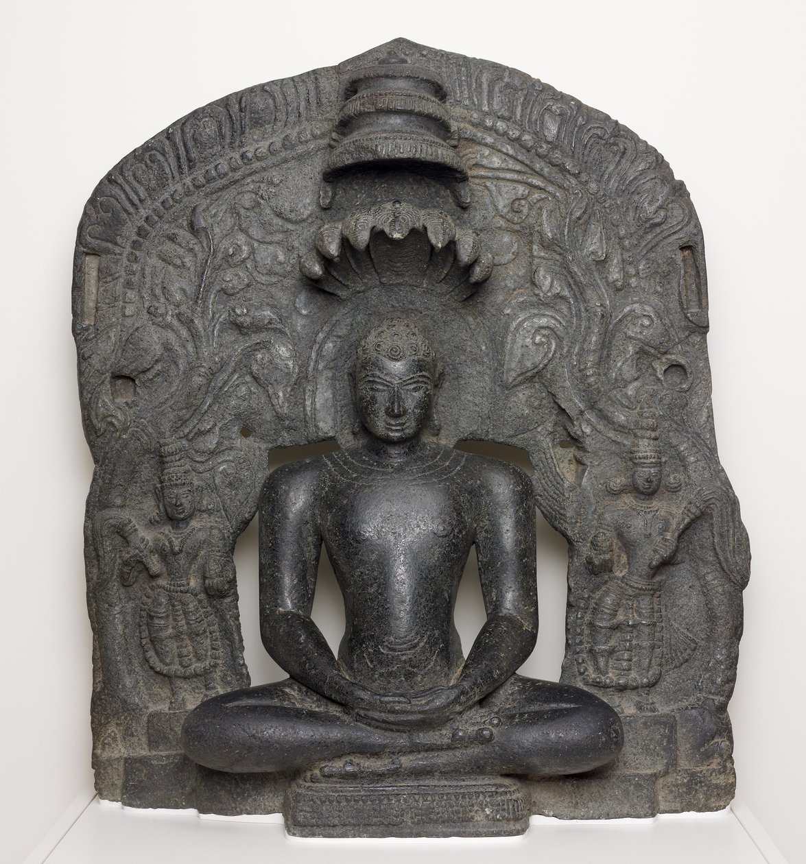 Jaina Tirthankara Parshvanatha with Serpent Hood Seated in Meditation by South Indian School