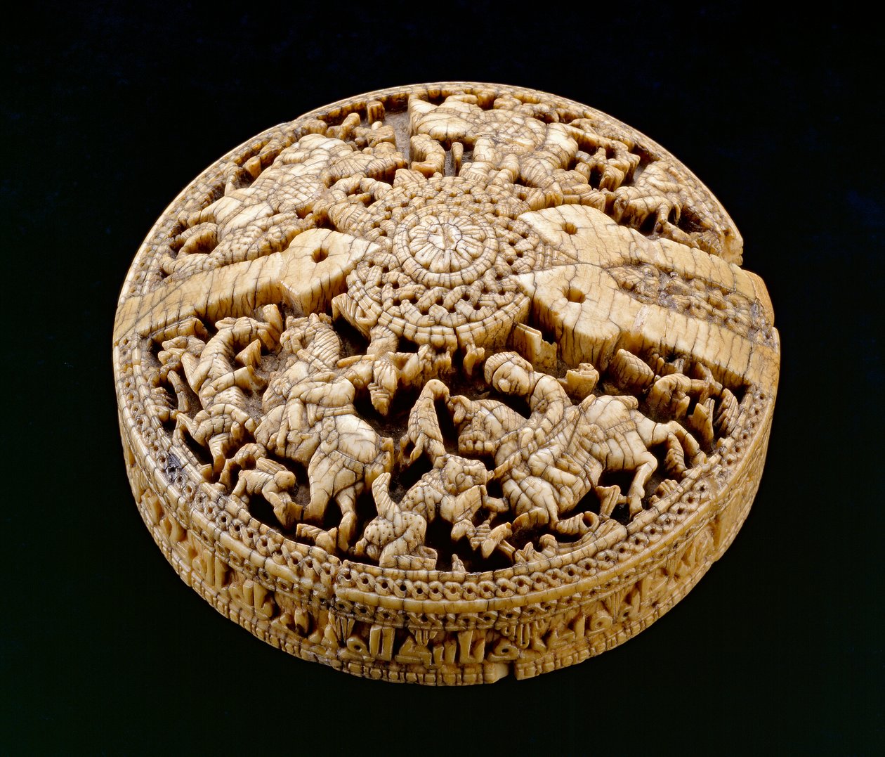 Lid of a container decorated with four huntsmen and animals, Umayyad period, 998-999 AD by Spanish School