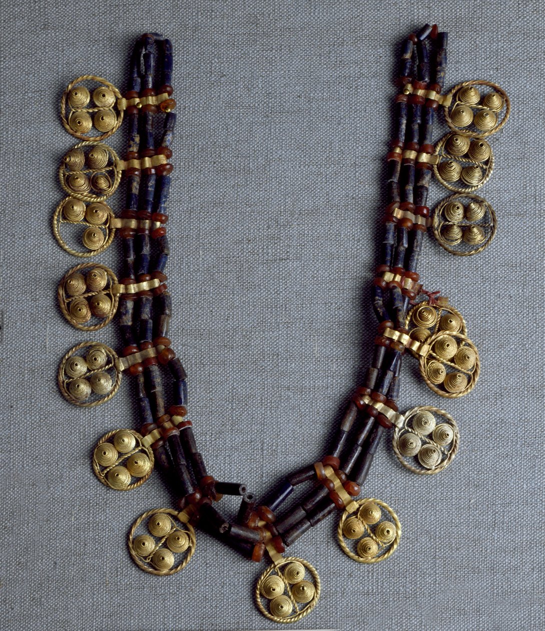 Sumerian Art: necklace with gold pendants and lapis lazuli beads used for the wedding. From the royal tombs of the site of Ur. 2600-2500 BC. National Iraq Museum Baghdad by Sumerian Sumerian