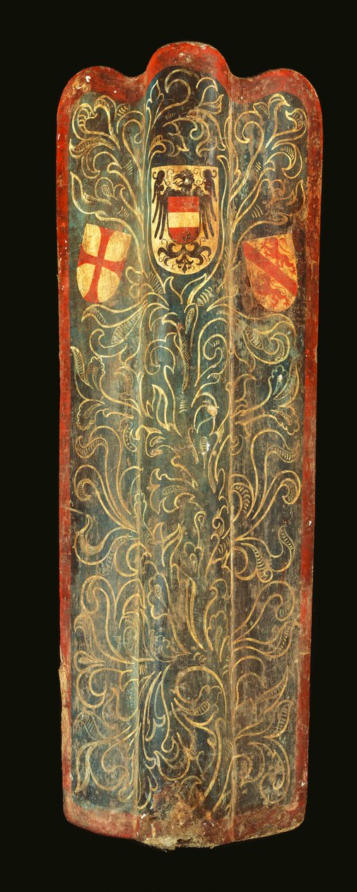 A rare Swiss pavise of wood covered with gesso painted canvas of green scrolling foliage design and the shields of arms of Habsburg, the League of St George, and the town of Winterthur by Swiss School