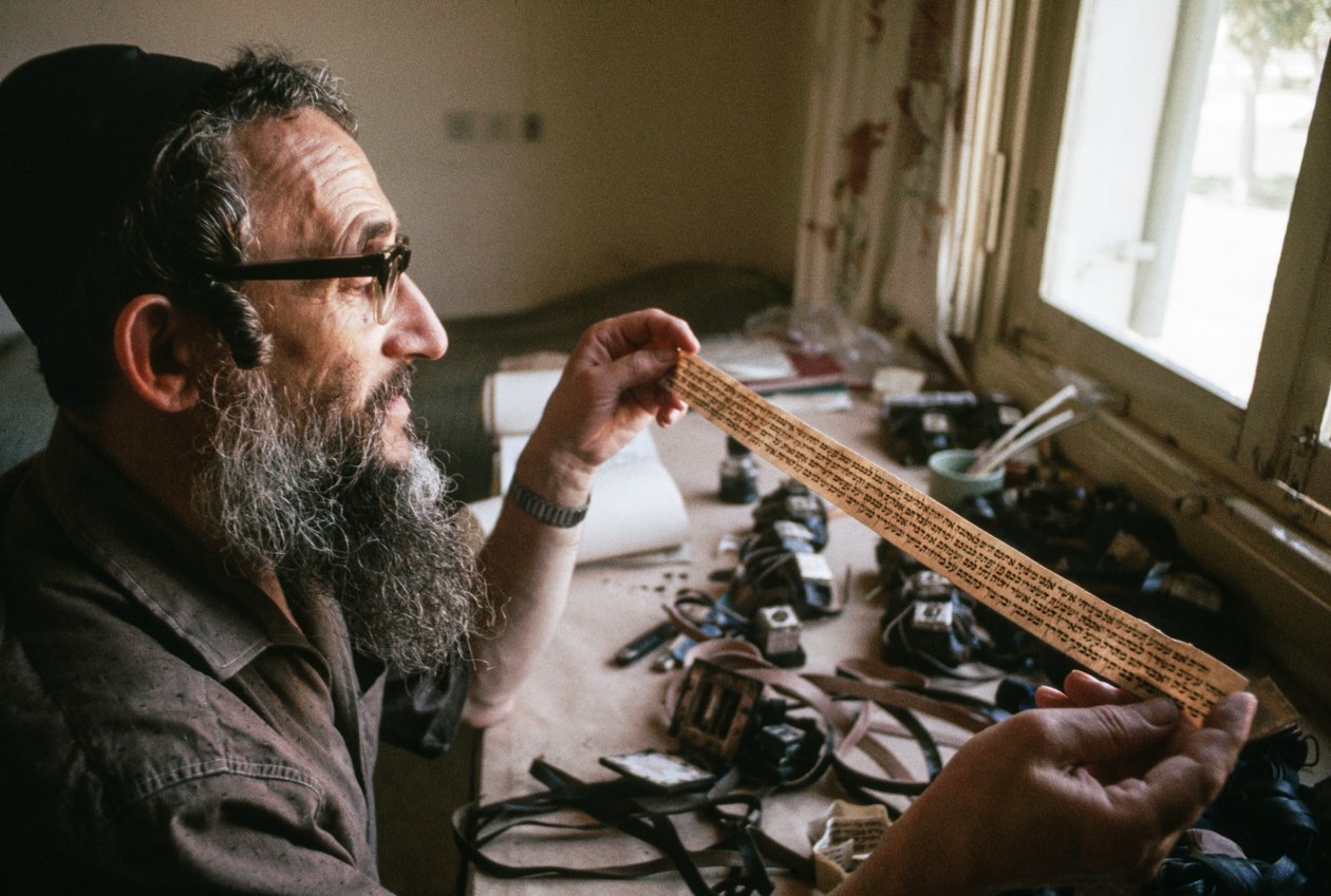 Scribe checks a Tefillin
