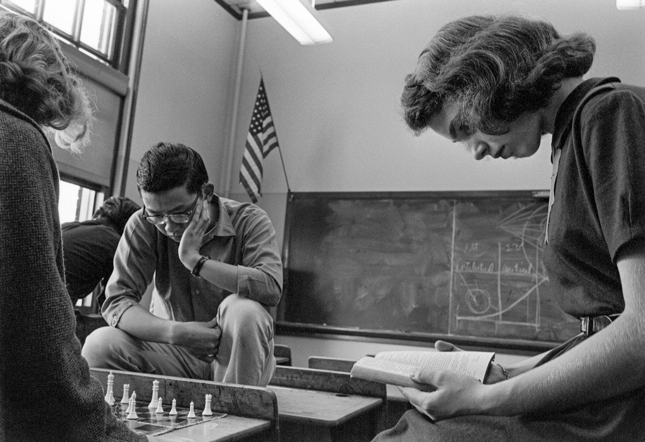 Students playing chess and reading at James A. Garfield High School, an urban public school by Ted Spiegel