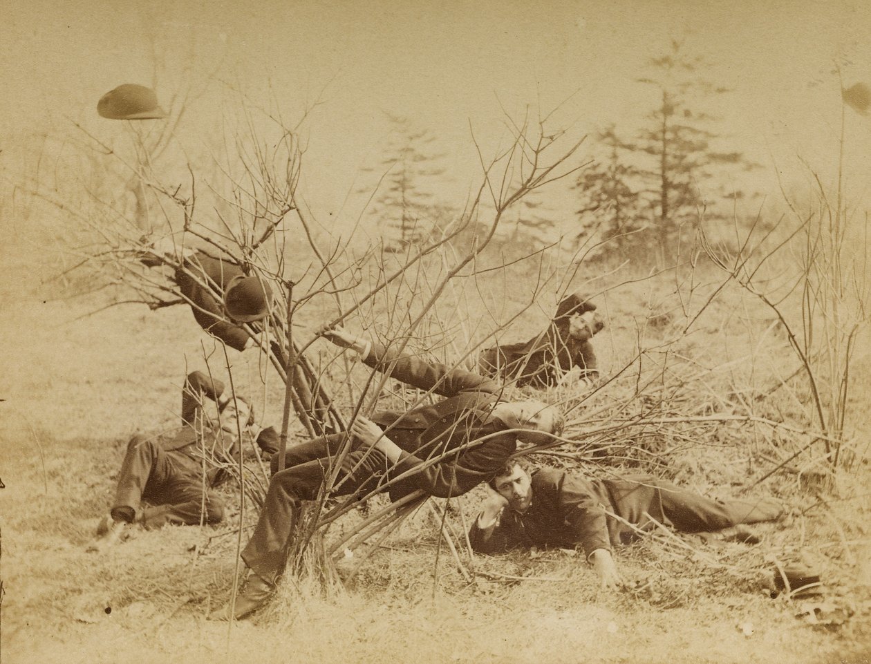 [Four male students reclining al fresco] by Thomas Eakins