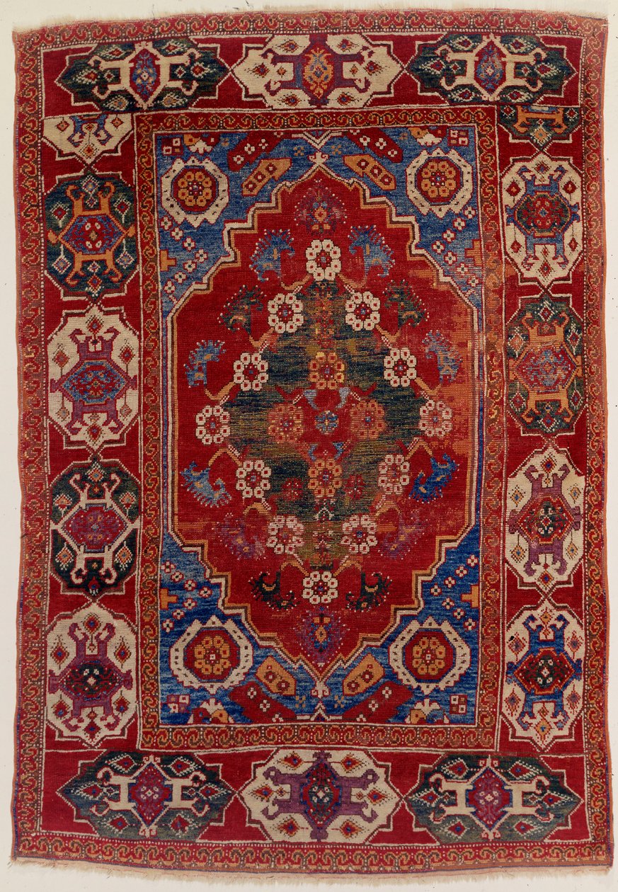 A Transylvanian Rug with Floral Motifs on a Brick Red Background by Transylvannian School