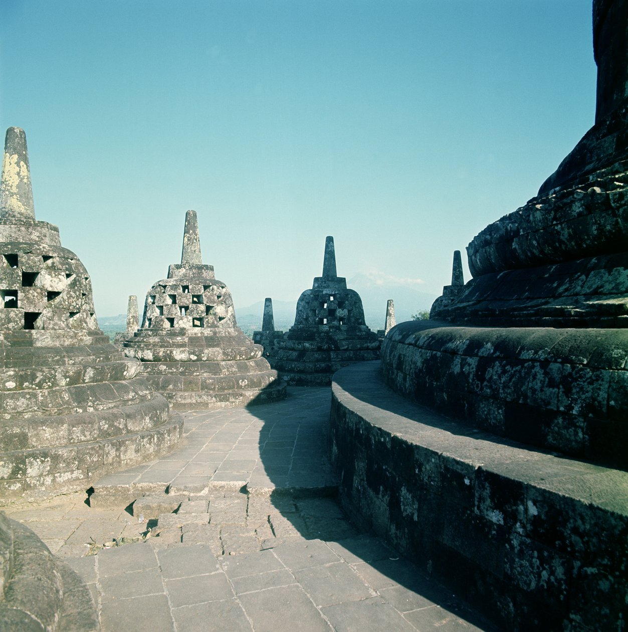 View of the uppermost circular terrace surrounded by latticed stupas or dagobs, erected c.800 AD by Unbekannt Unbekannt