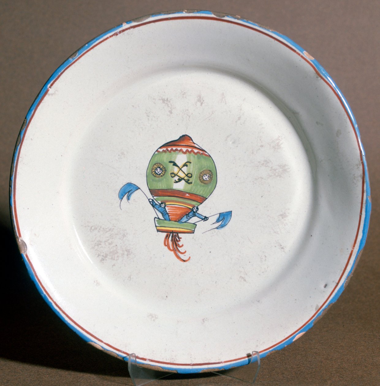 A French Faience Plate with Aeronauts with Flags by Unbekannt