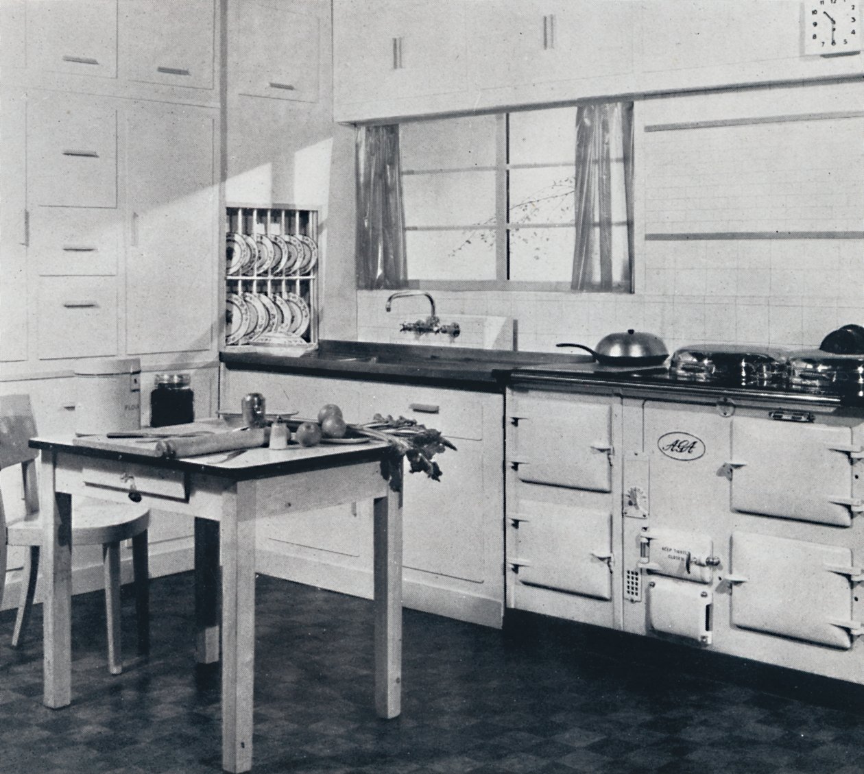Aga Heat Ltd. The Model F Aga Cooker for a large house finished in black and cream vitreous enamel by Unbekannt