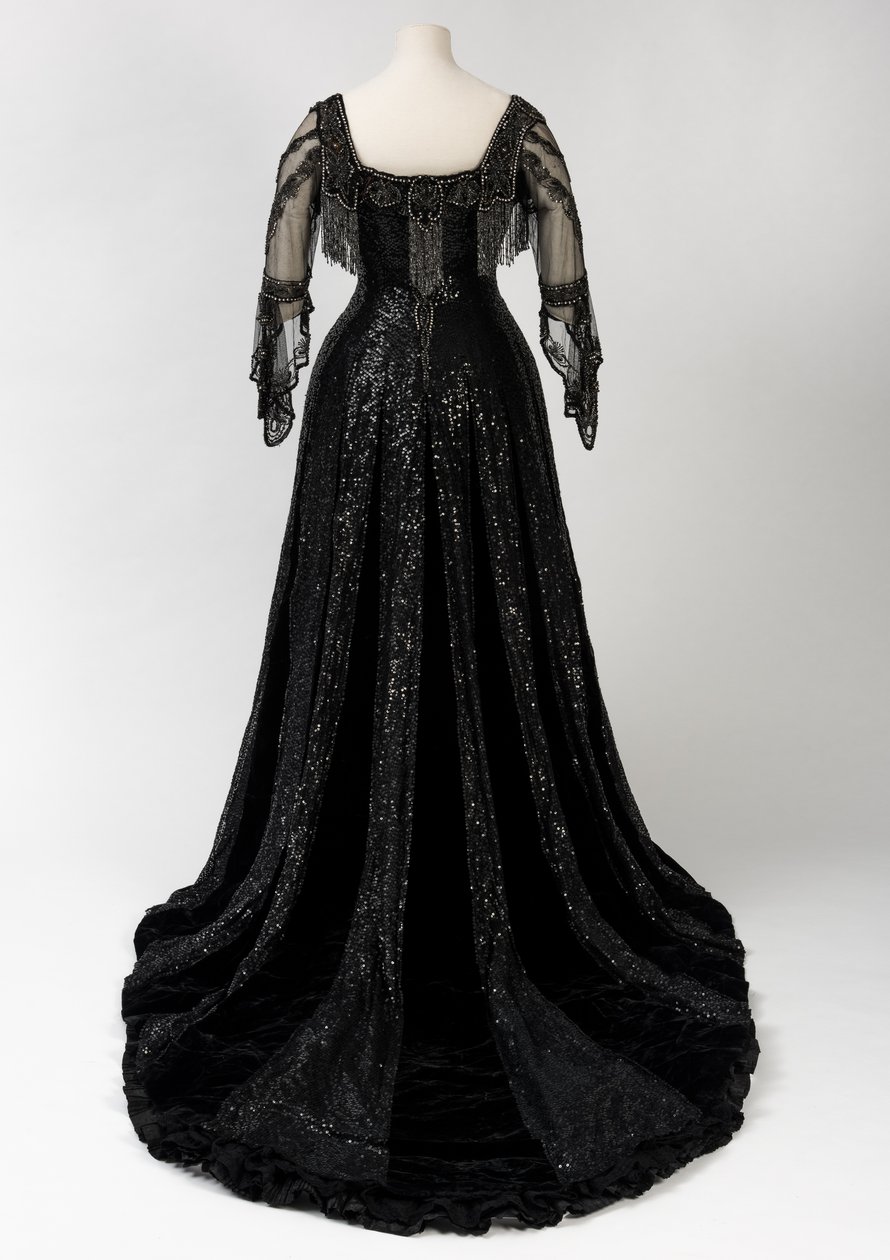 Black Full Length Evening Gown Worn by Queen Alexandra, with Bead and Sequin Decoration and Incorporating Queen Alexandra’s Signature Black Silk and Gold Lettered Name Tape, Made by Barolet of Knightsbridge, London 1908-1910 by Unbekannt
