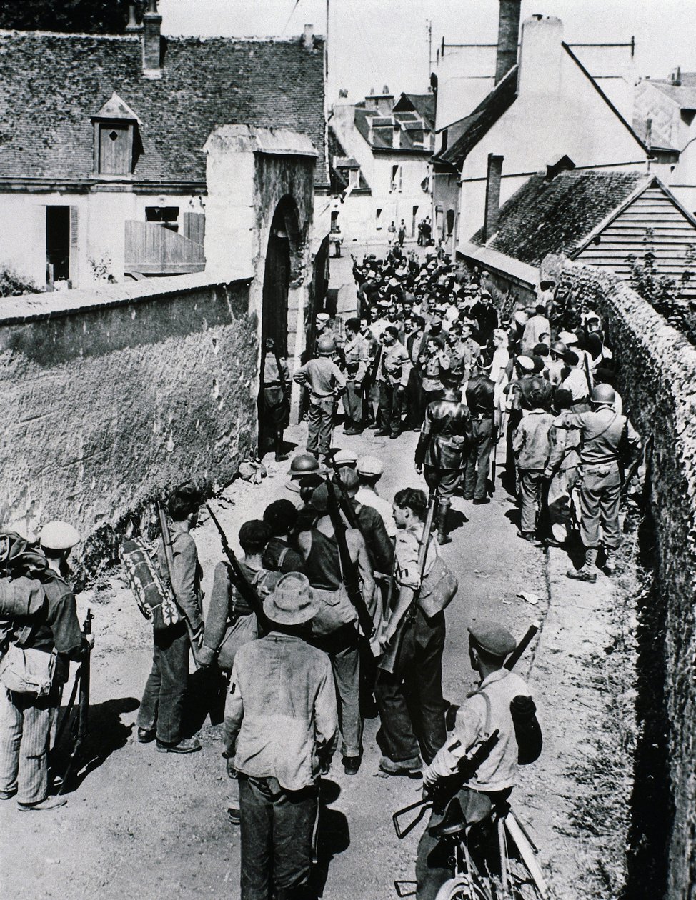 Groups of French Resistance fighters wait for the distribution of weapons in a house, July 1944 by Unbekannt