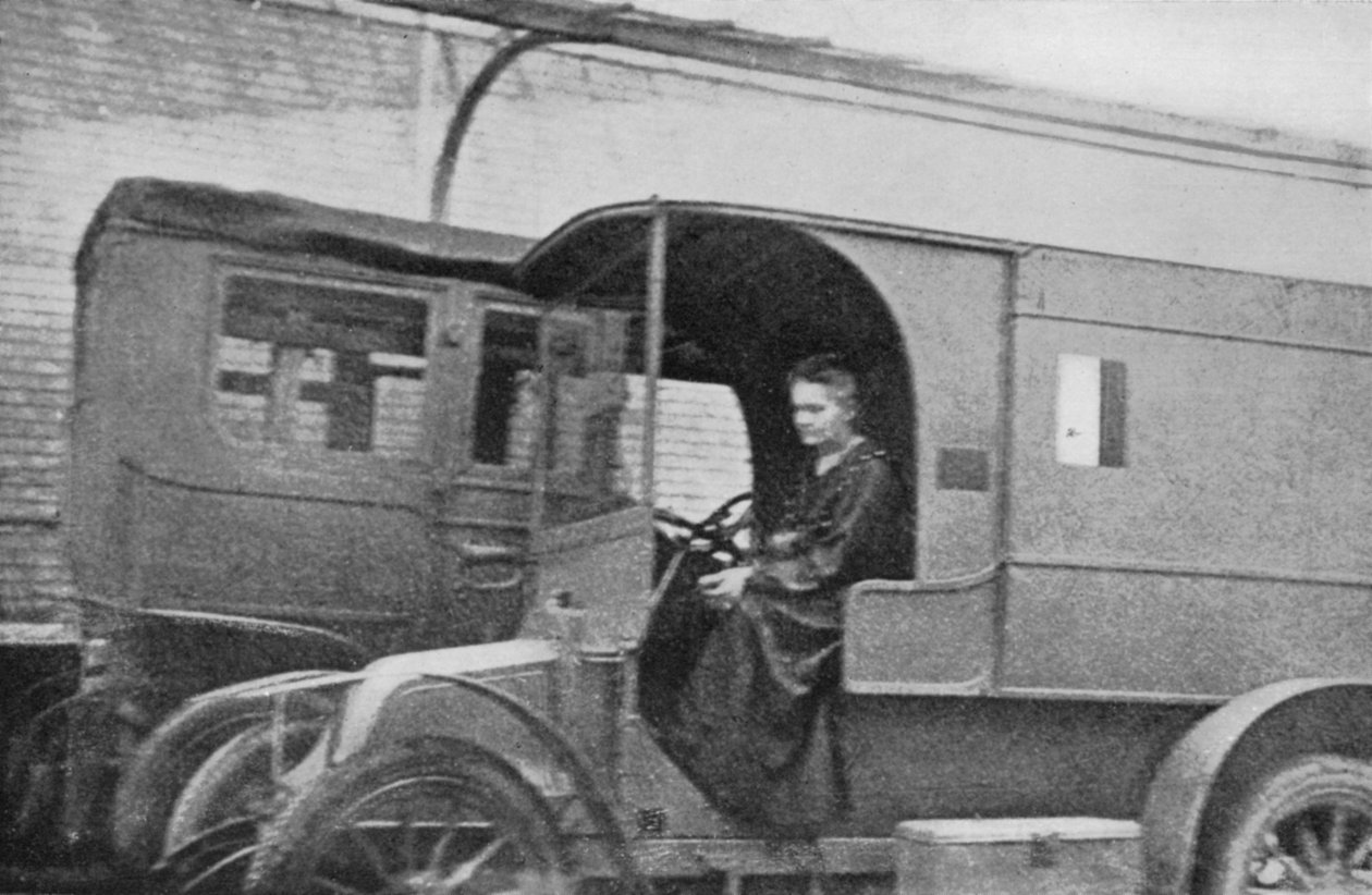 Marie Curie, Polish-born French Physicist, Driving a Car Converted into a Radiological Unit by Unbekannt