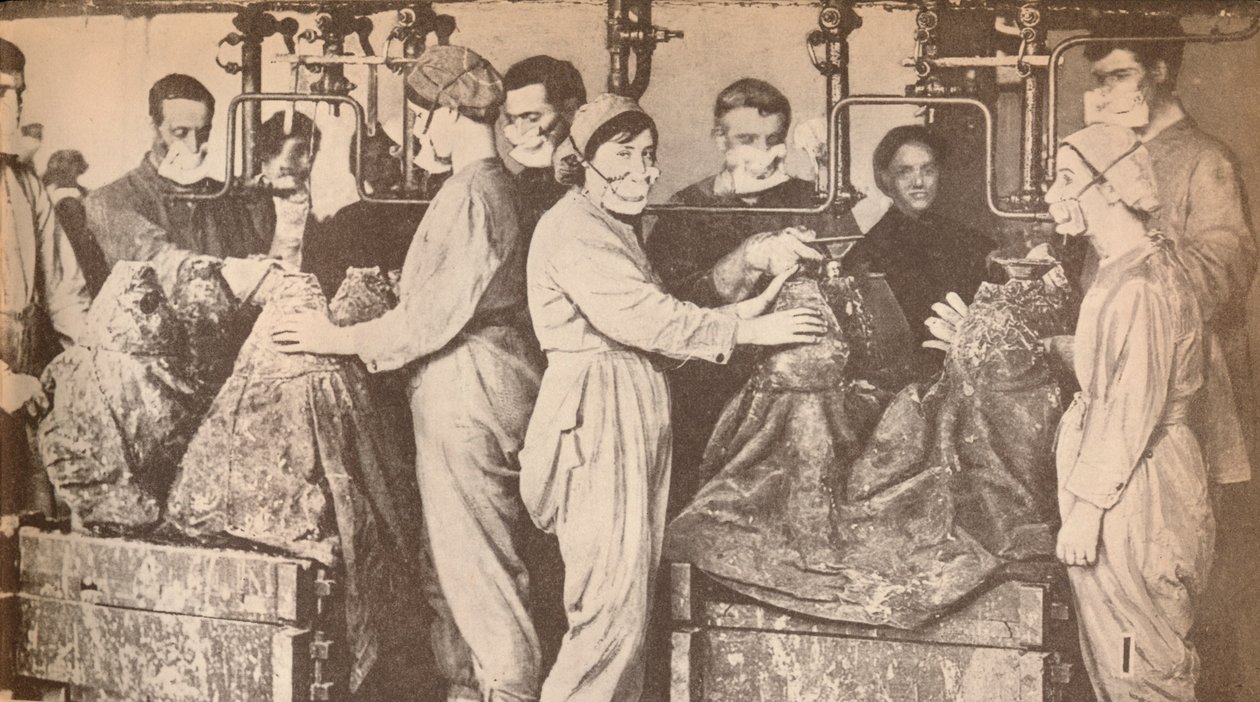 Munition Workers Wearing Respirators While Filling Shells with Trinitrotoluene (T.N.T.) by Unbekannt