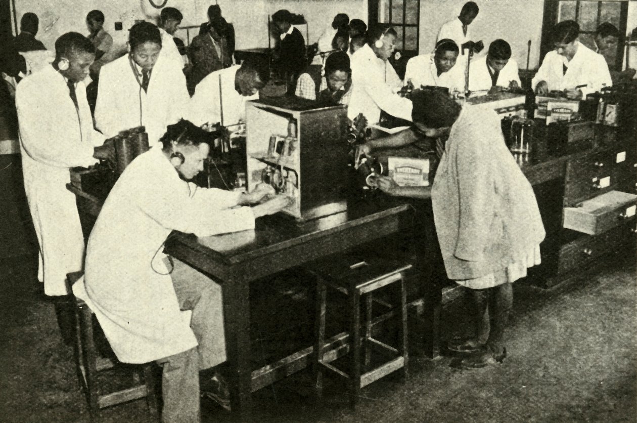 Scenes in a Native College - Students in the physics laboratory by Unbekannt