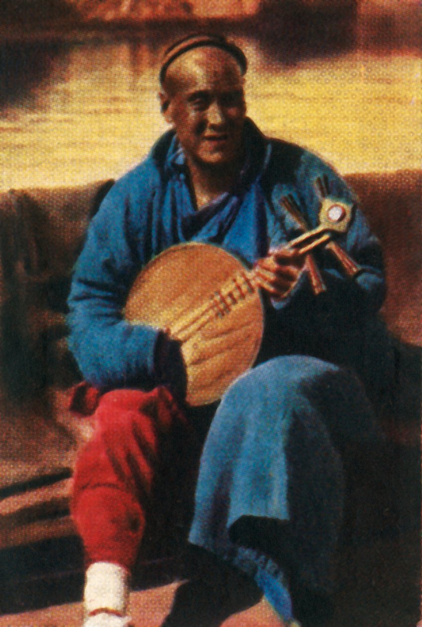 Travelling musician, China, c1928 by Unbekannt