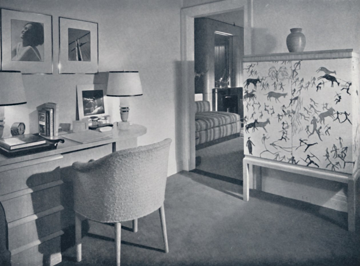 W. & J. Sloane. Photographers hobby room showing a desk in natural oak, a hand-woven covering on the table by Unbekannt