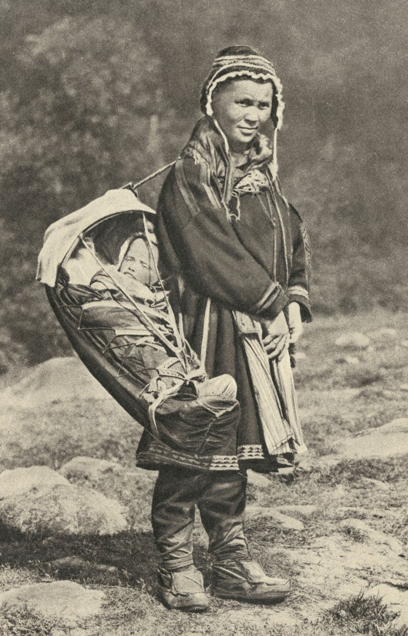 Sweden. Lapp woman carrying her baby in a cradle of reindeer skin. 1920 by Unbekannt