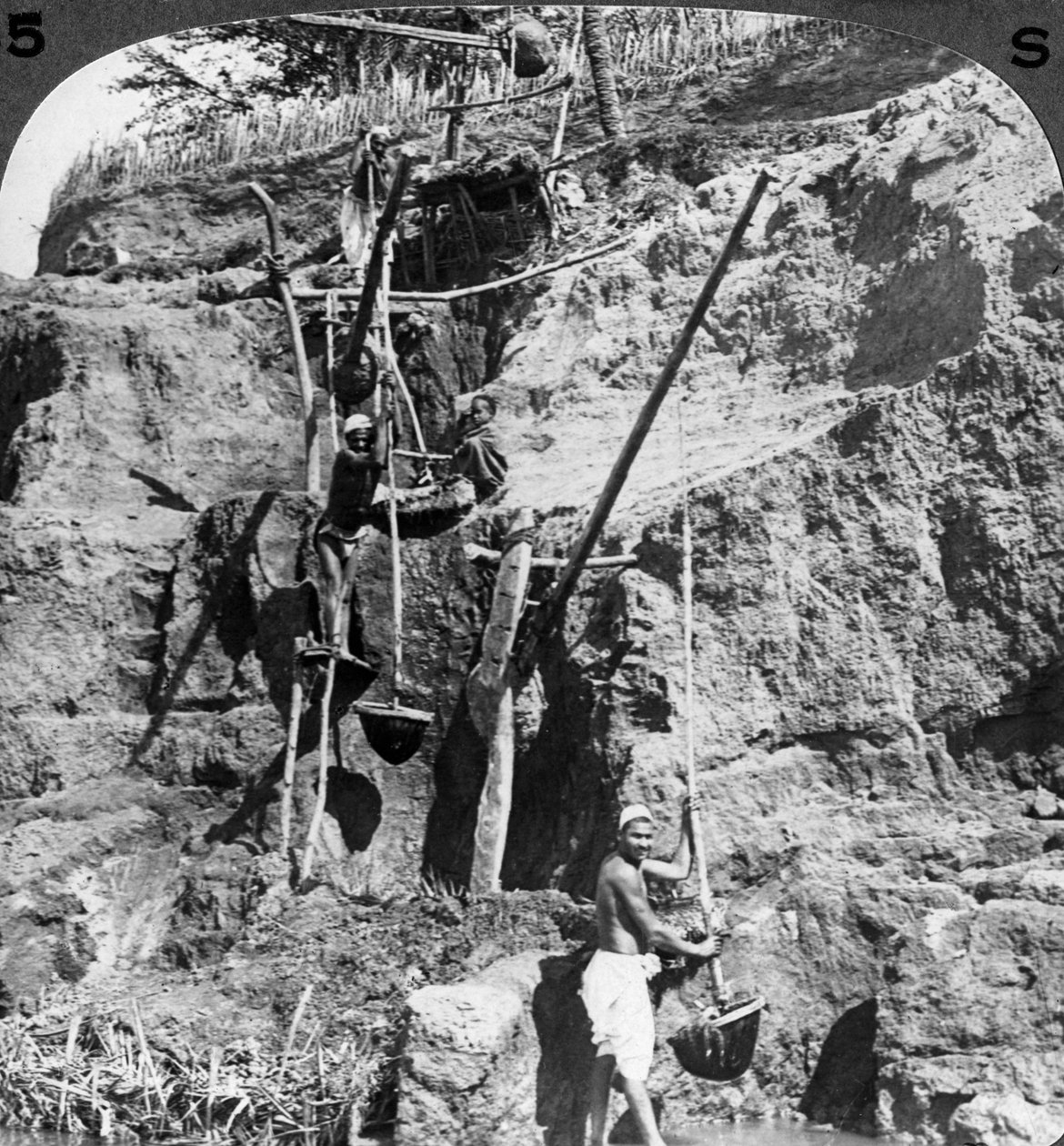 An Egyptian shaduf lifting the Nile waters to the thirsty fields, Egypt by Underwood and Underwood