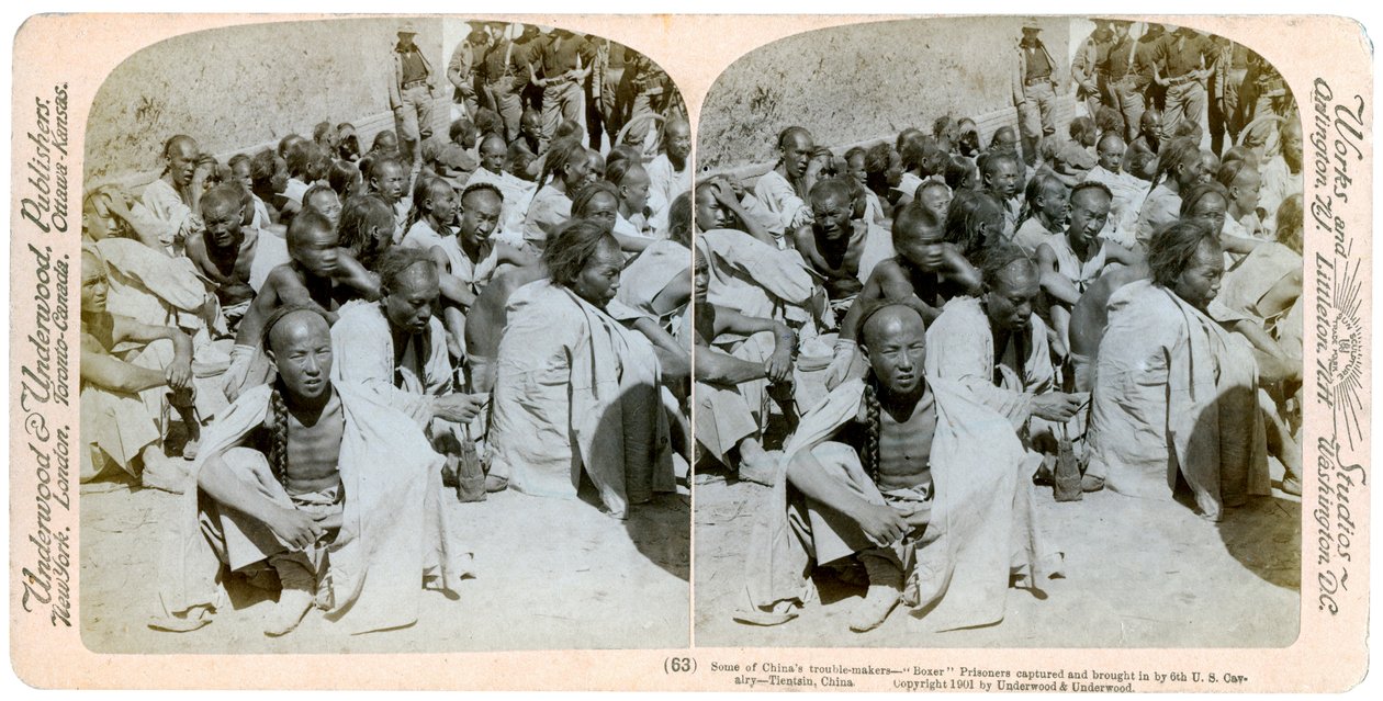 Boxer prisoners captured and brought in by the US 6th Cavalry, Tientsin, China, 1901 by Underwood and Underwood